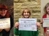 Three images together - one showing woman holding sign saying "#WhyOurHRAMatters... It protects the thing that matter to us", one of a woman holding a sign saying "#WhyOurHumanRightsActMatters The HRA protects us by putting checks and balances on the power of public bodies" and one of a girl in a school uniform and tiara holding a sign saying "#WhyOurHumanRightsActMatters it supports me to choose things about my life"